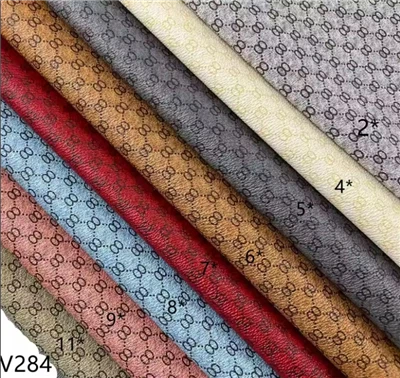 Tela de couro luxuosa do couro do PVC do estilo da marca de couro de matérias têxteis V284 para sacos das sapatas